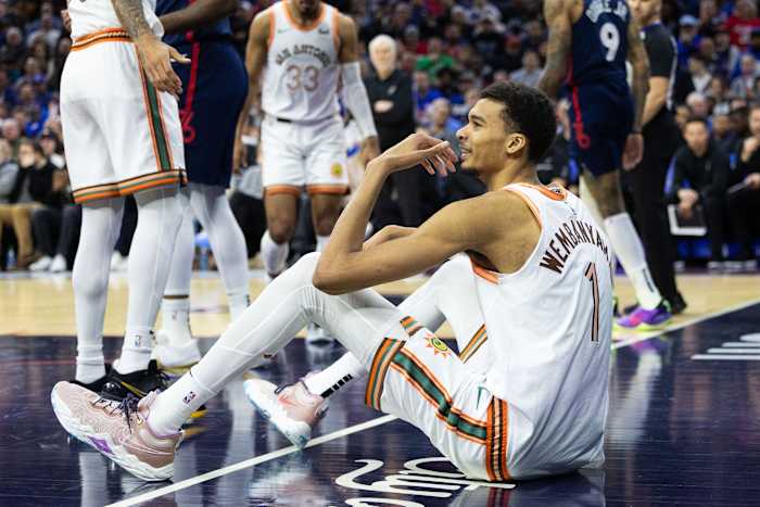 Jan 22, 2024; Philadelphia, Pennsylvania, USA; San Antonio Spurs center Victor Wembanyama (1) reacts on the floor after being called for a foul against the Philadelphia 76ers during the first quarter at Wells Fargo Center.